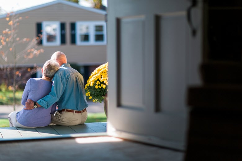 Senior couple sitting on porch
